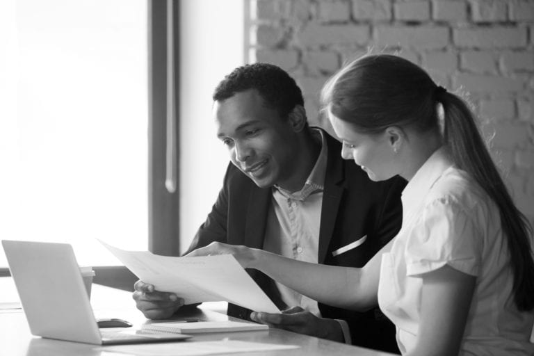 Female advisor leading male african-american intern in tasks