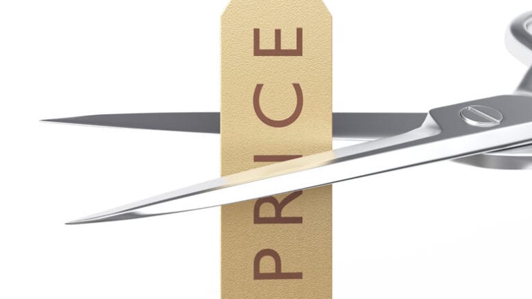 Scissors cutting a price tag