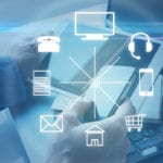 Hands with a tablet and different icons around. Omni channel