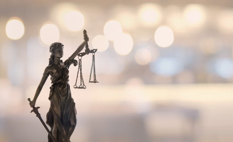 Justice law legal concept. statue of justice or lady justice with blurred background.