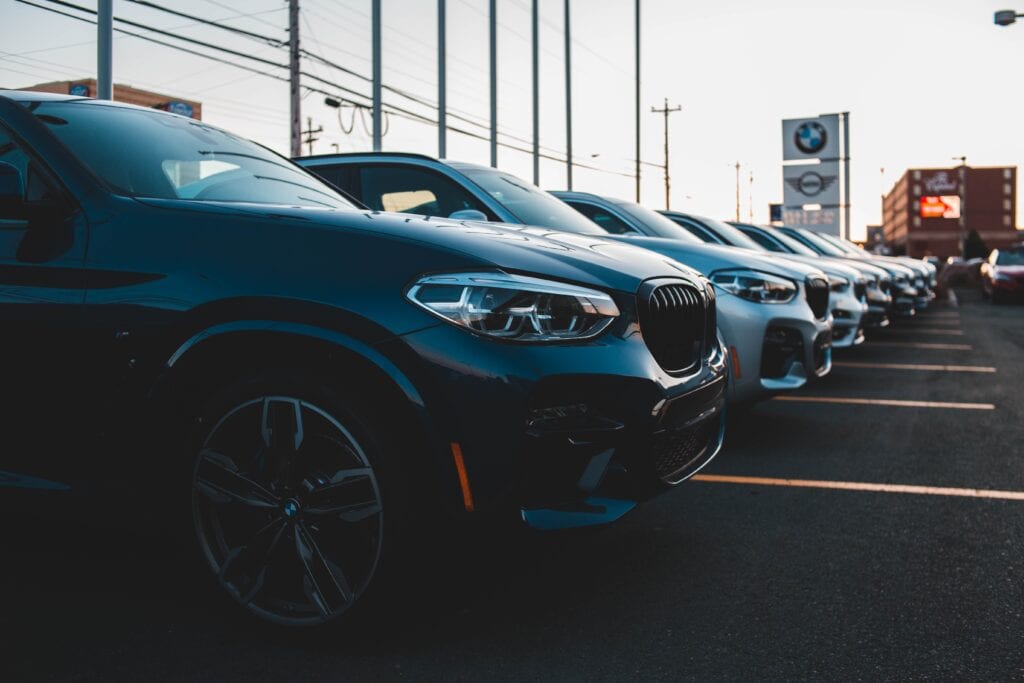 Image of cars parked at a car dealership.