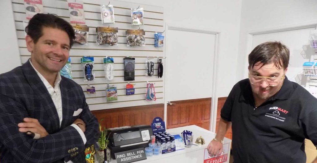 Eugene Alletto, CEO of Bedgear, with an actor portraying the proprietor of a spoof sleep shop at the Las Vegas Market