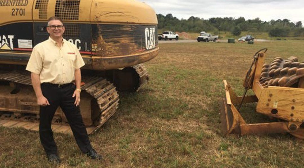 David Berggren stands on the ground where his fifth furniture store will be built in Clarksville, Tenn.