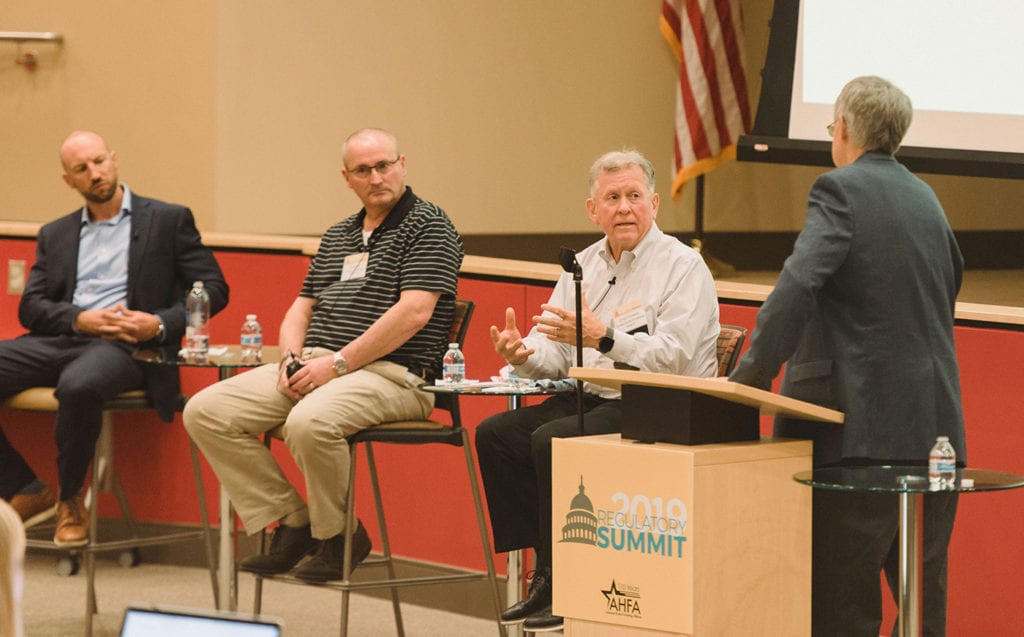 From left, Jameson Dion, Chris Fox and Greg Crowley lead a discussion on furniture safety moderated by Doug Clark