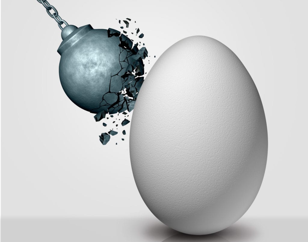 Wrecking ball striking an egg