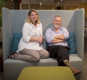 Photo shows a couple on a sofa