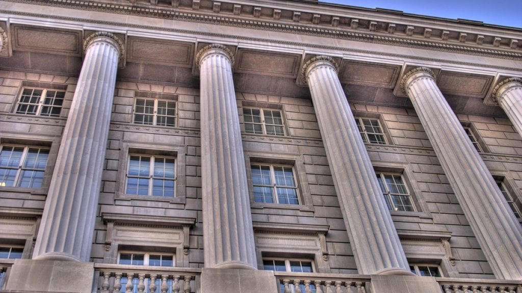 Image shows a government building with tall columns