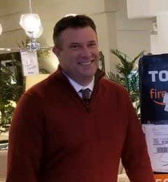 Image shows a man in a furniture store