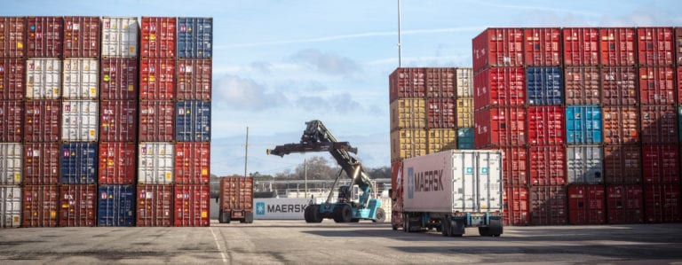 Image shows cargo containers at a port