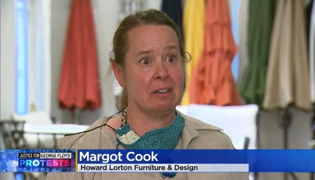 Image shows a woman on television