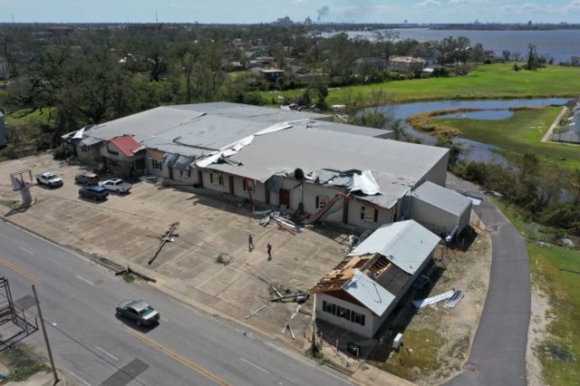 Image shows a damaged building from the air