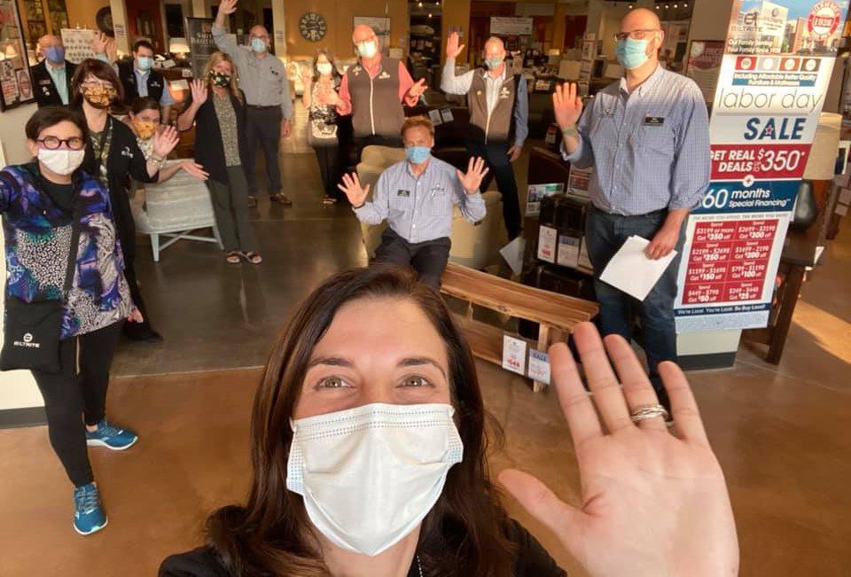 Image shows people in a furniture store