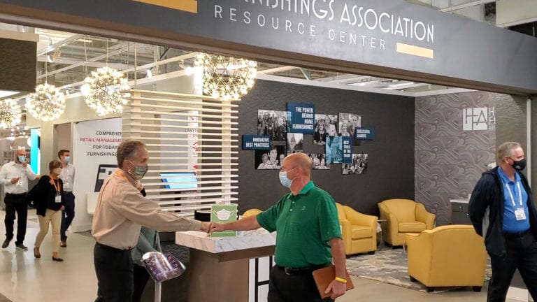 Image depicts people in the furniture showroom