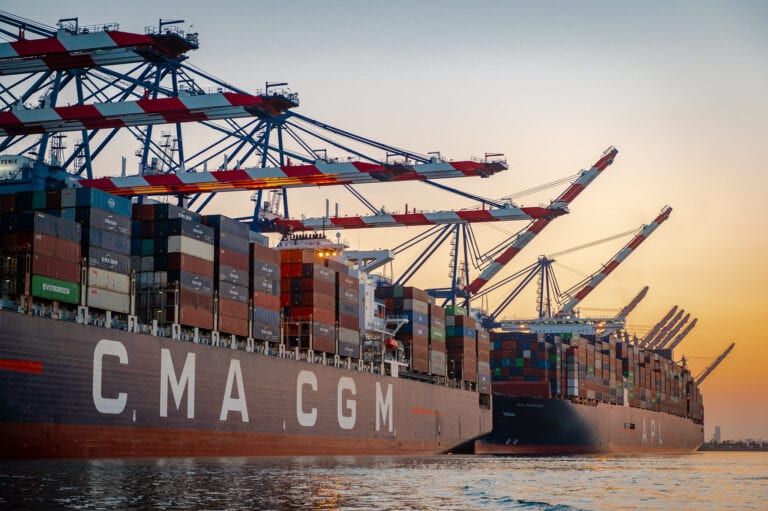 Image shows container ships and cranes