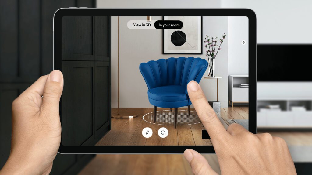 person holding iPad pointing to picture of augmented reality chair on an eCommerce Furntiure Store website.