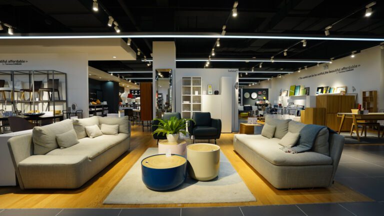 Inside a furniture store with sofa and chair displays.