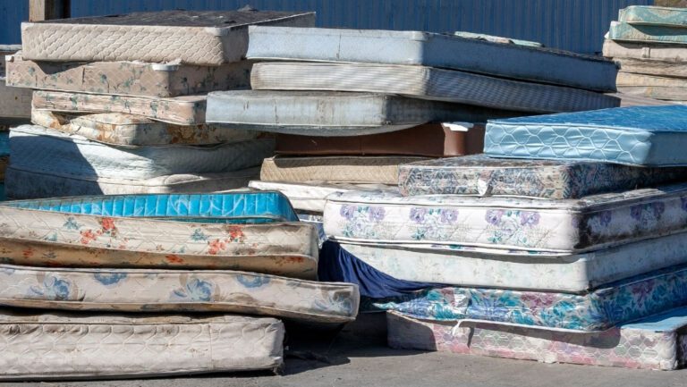 A pile of used mattresses ready to be recycled