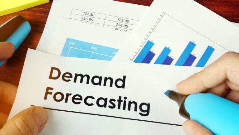 Man holding documents with name Demand Forecasting.