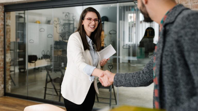 Openly greeting a job recruiter with a firm handshake