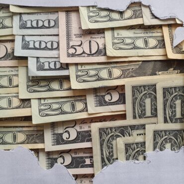 Map of USA with money across the country.