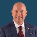 Headshot of Todd Wanek, the President & CEO of Ashley Home Furnishings