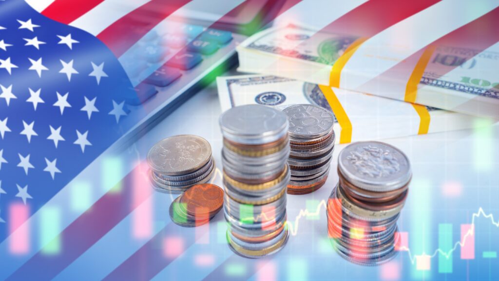 Money and calculator on table with the US flag overlaid.