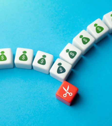 Reducing costs at one point entails a failure and a decrease in work efficiency. Cutting spendings. Optimization of costs. Budget cuts, tough economy. Inflation.