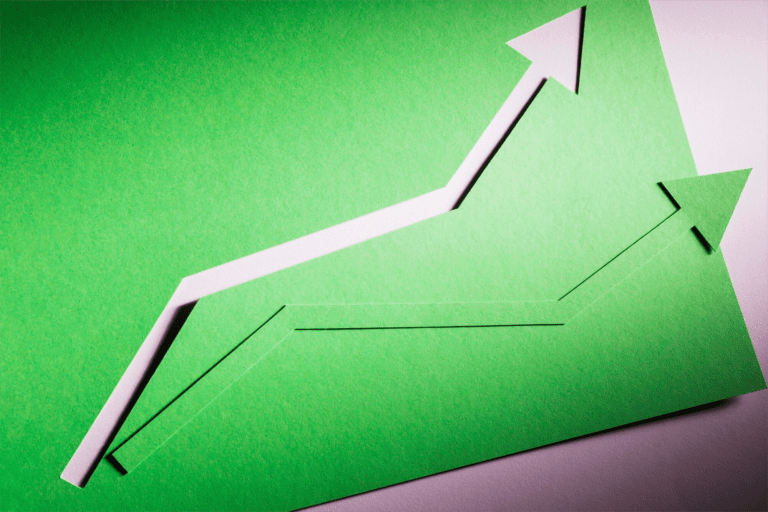 A rising economic arrow cut out of felt. Created by Freepik.com