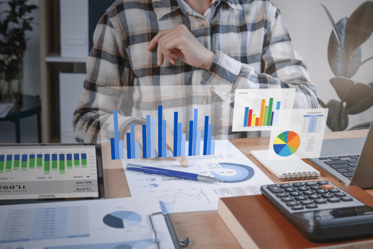 A business man in front of his computer looking at all of his business figures. Picture generated by Freepik.com