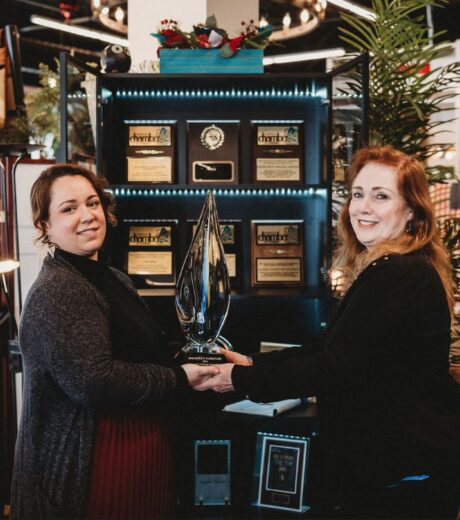 Genevieve Wilma Young and Saundra Wilma HFA Retailer of the Year holding award.