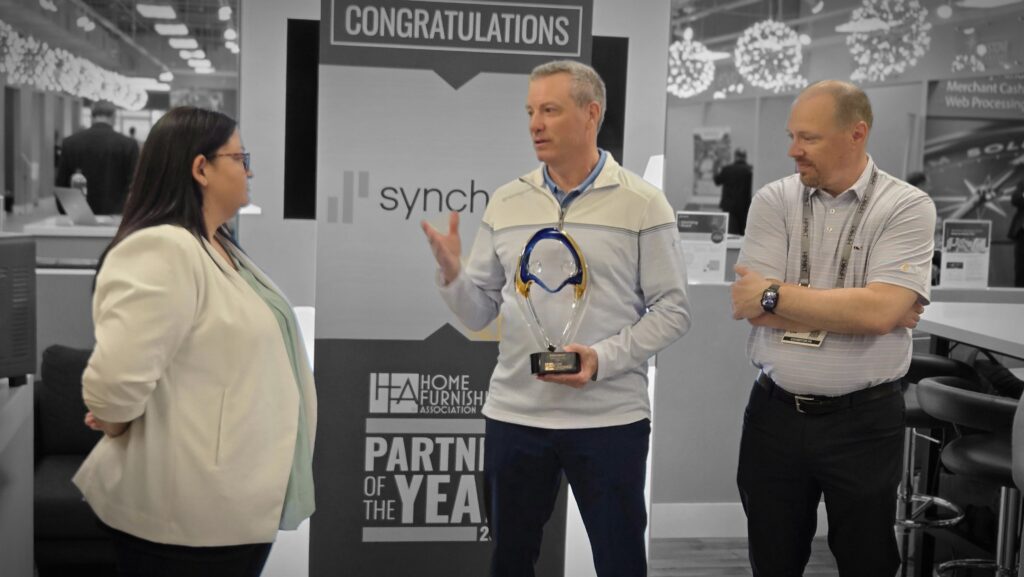 Synchrony's Rob Krause accepting the 2025 Partner of the Year Award from HFA's Shannon Williams.