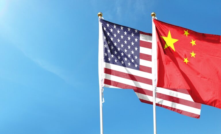 The USA and China Flags blowing in the breeze next to each other