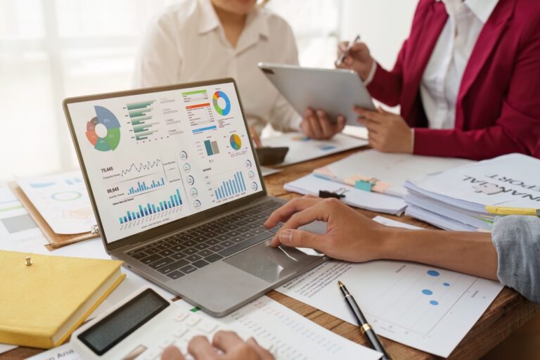 Close up Business team looking at marketing analytics and strategy, meeting concept