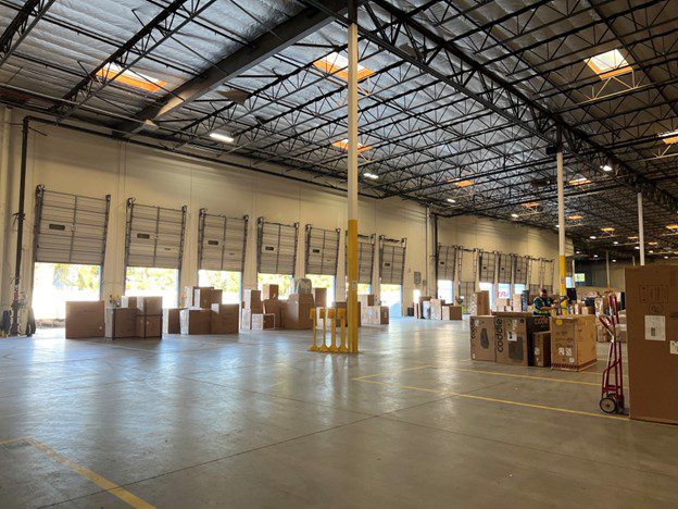 Furniture being staged in a furniture warehouse.