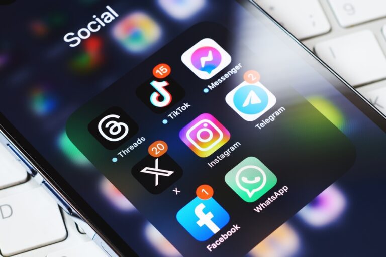 smartphone screen surrounded by other social media network apps. Twitter rebranding. Modern social media communication.