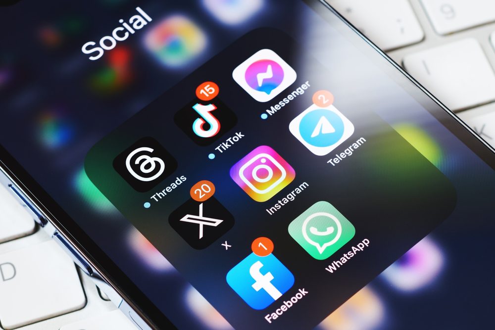 smartphone screen surrounded by other social media network apps. Twitter rebranding. Modern social media communication.