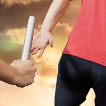 Passing the baton from one runner to the next.