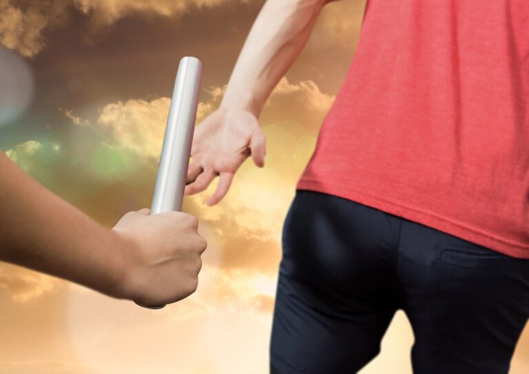 Passing the baton from one runner to the next.