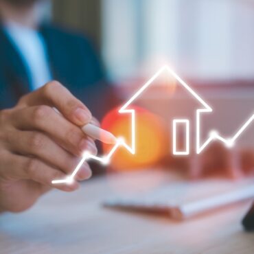 real estate investment energy efficiency rating and property value, Real estate online. new home for the family, home search, land price, property tax man using computer working with virtual chart