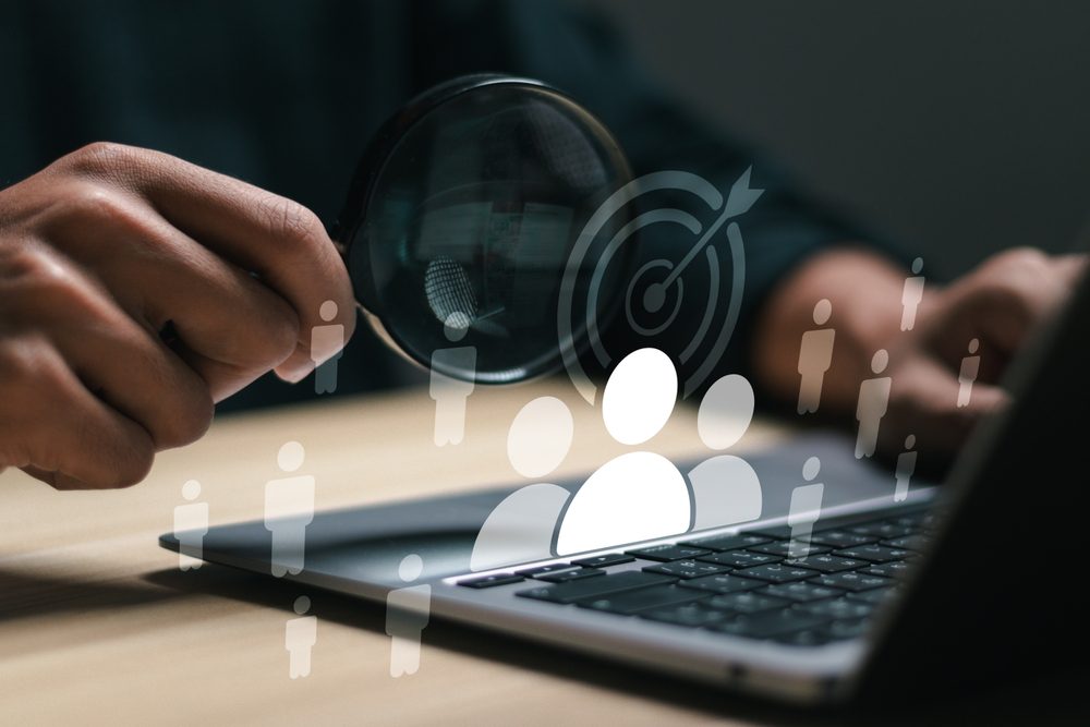 Targeting customer concept. Businessman use laptop with target customer icons for customer focus group. Digital marketing online, CRM, Data exchanges development and customer service.