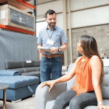Male sales associate working with a female cusotmer.