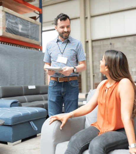Male sales associate working with a female cusotmer.