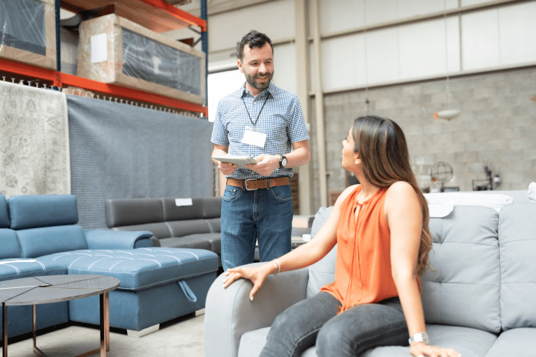 Male sales associate working with a female cusotmer.