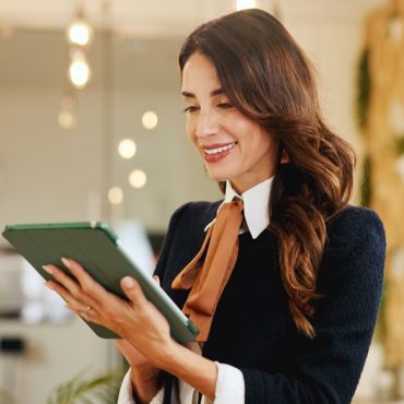 Smile, business woman and tablet in hotel for online booking, reservation schedule or information update. Digital technology, worker and internet communication with hospitality manager on checkin app