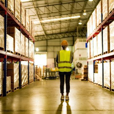 operation worker woman checking and inspecting cargo for stack items for shipping. Staff checking the store factory. industry factory warehouse.