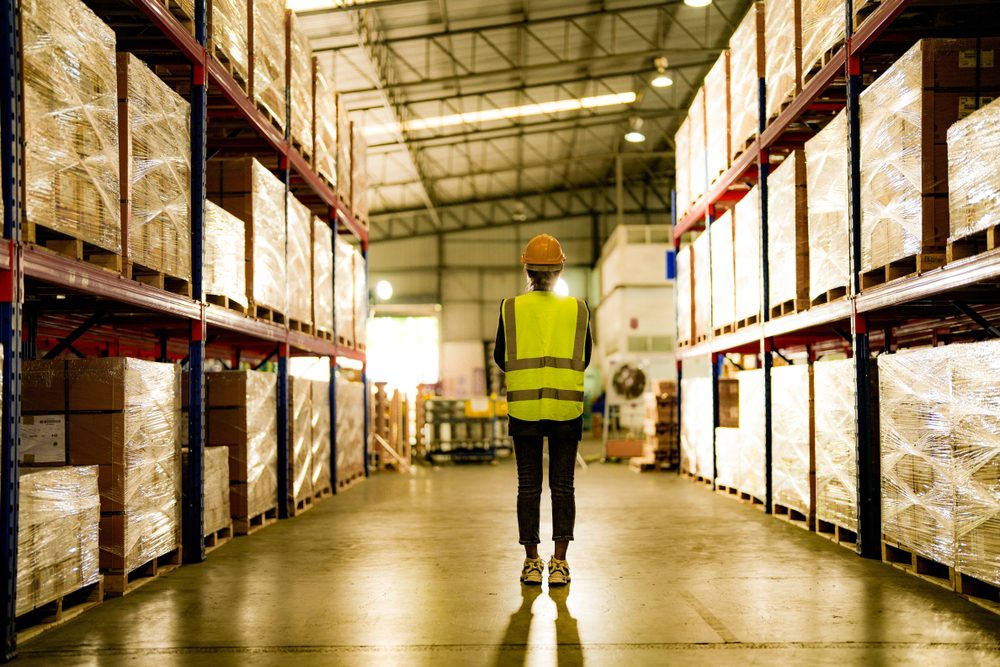 operation worker woman checking and inspecting cargo for stack items for shipping. Staff checking the store factory. industry factory warehouse.
