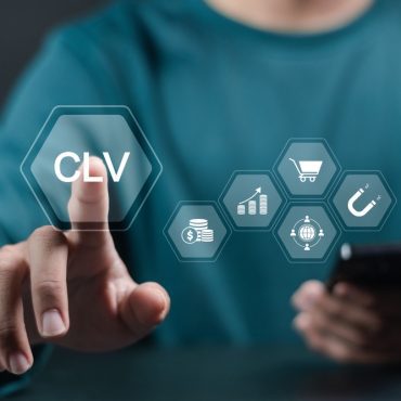 CLV, Customer lifetime value concept. Increasing CLV marketing strategy planning, Businessman touching CLV icon on virtual screen.